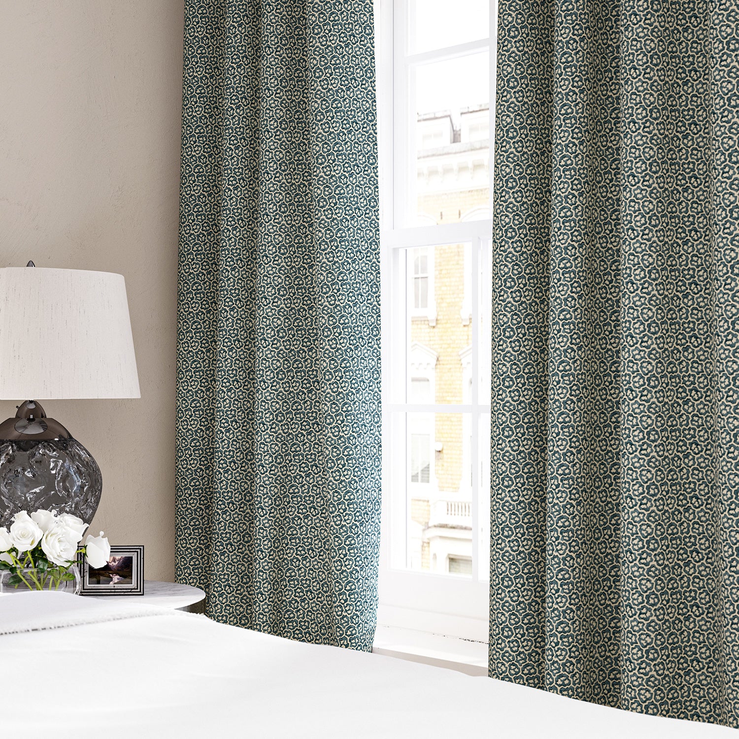 Linen curtains with a block print pattern in blue and cream
