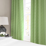 Linen curtains with a block print pattern in green and cream