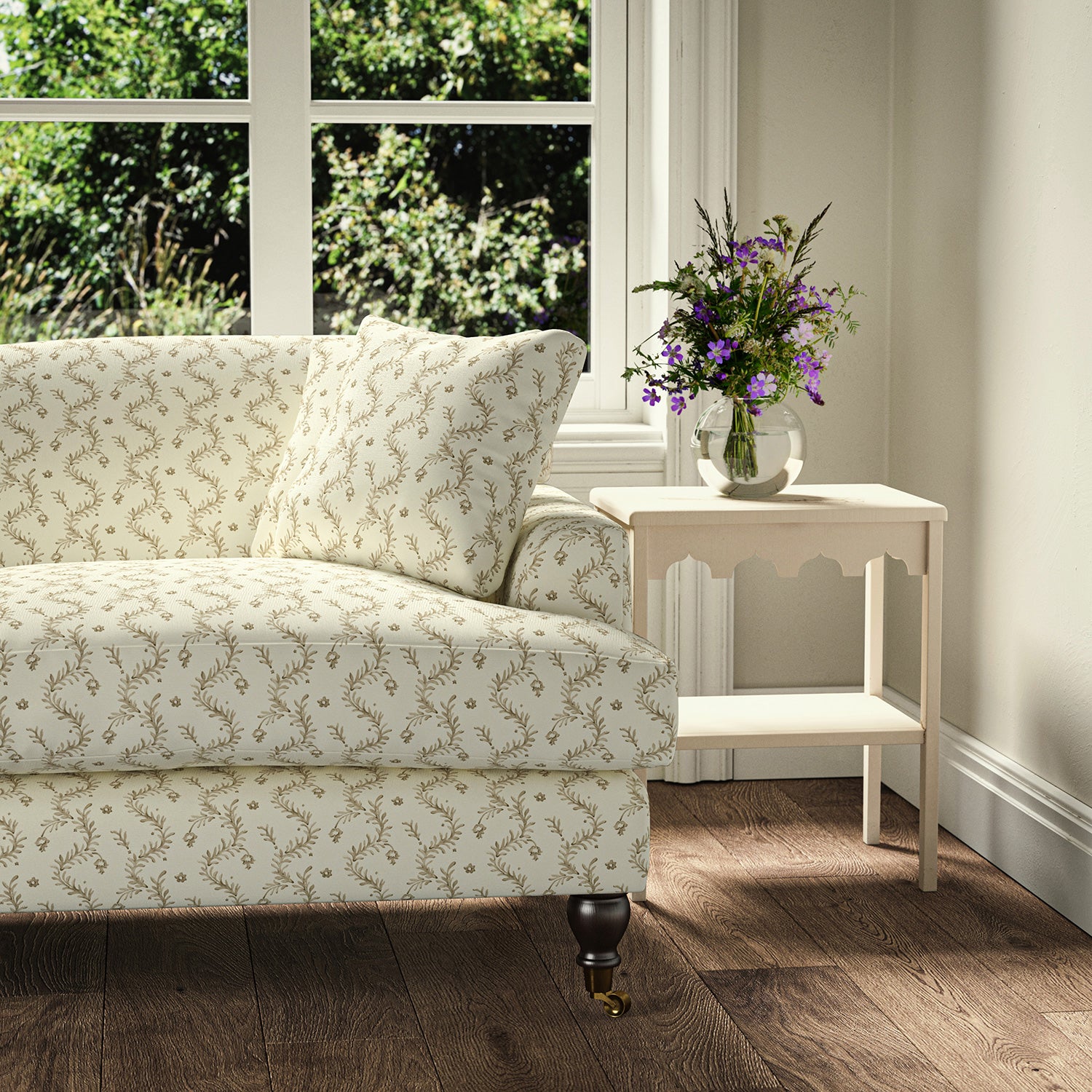 Printed linen fabric - a charming marine-style pattern in brown and cream – on a sofa