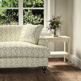 Printed linen fabric - a charming marine-style pattern in brown and cream – on a sofa