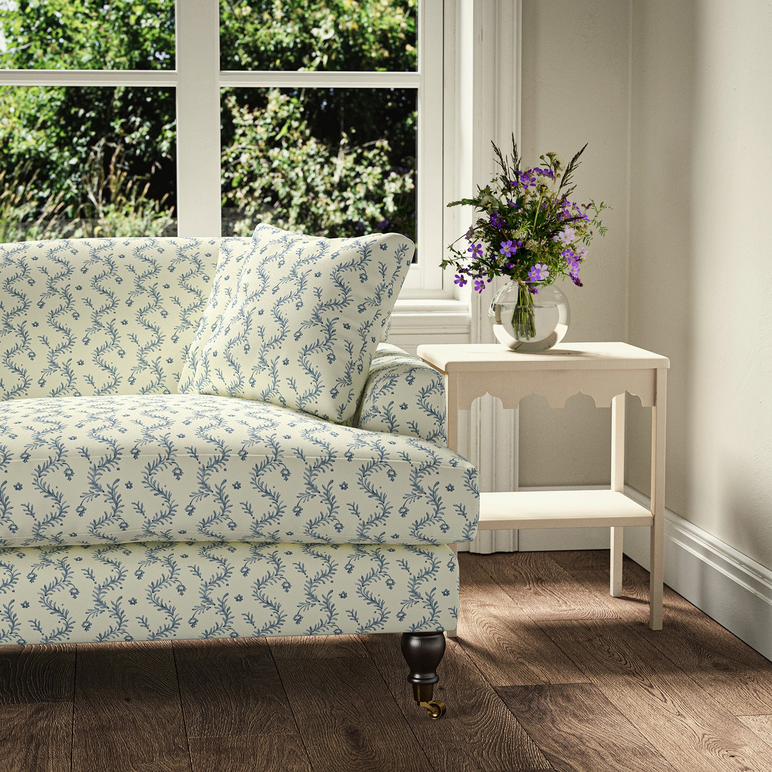 Printed linen fabric - a charming marine-style pattern in blue and cream – on a sofa