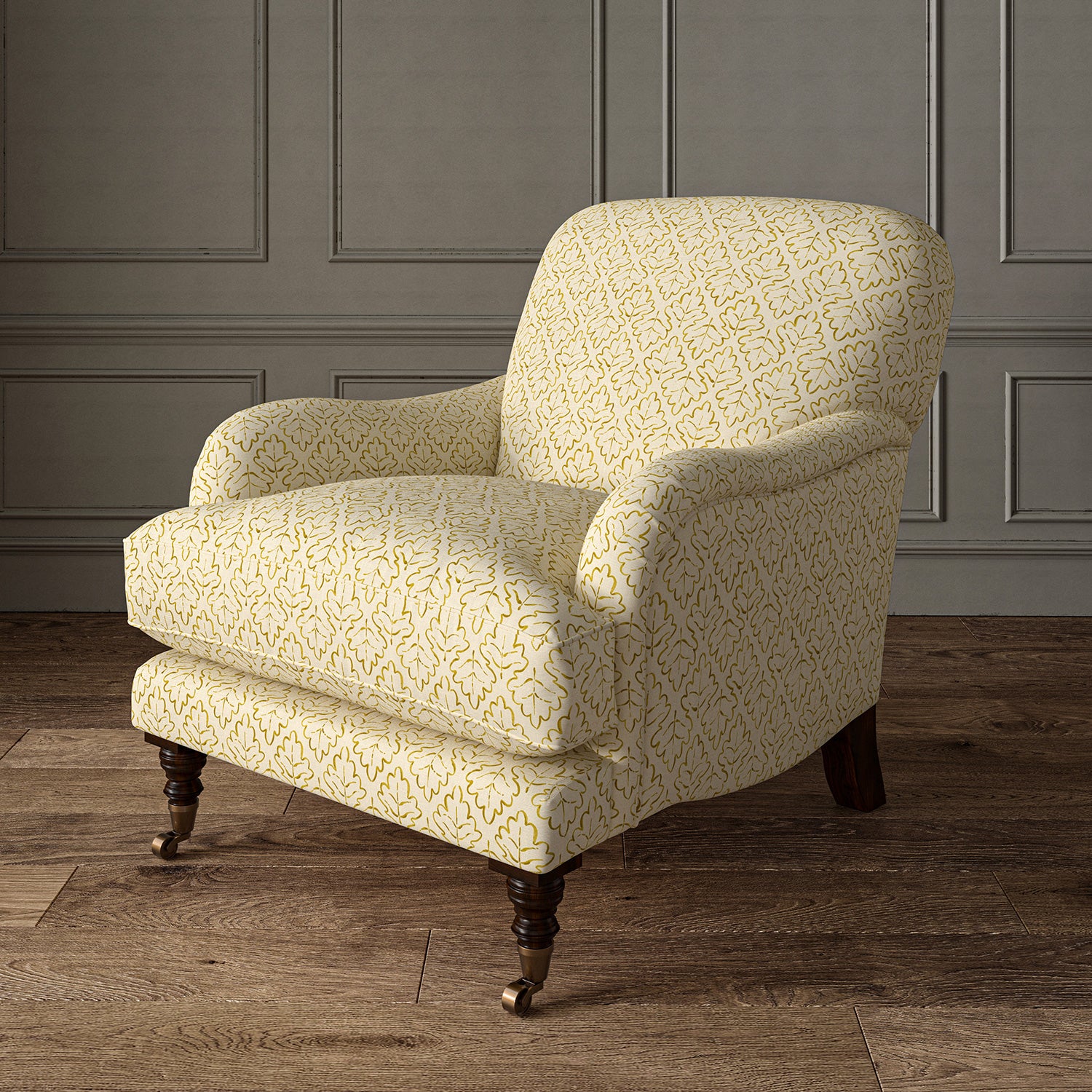 Printed linen fabric – a hand drawn; mirrored leaf motif pattern in yellow and cream – on an armchair