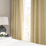 Linen curtains with a hand drawn; mirrored leaf motif pattern in yellow and cream