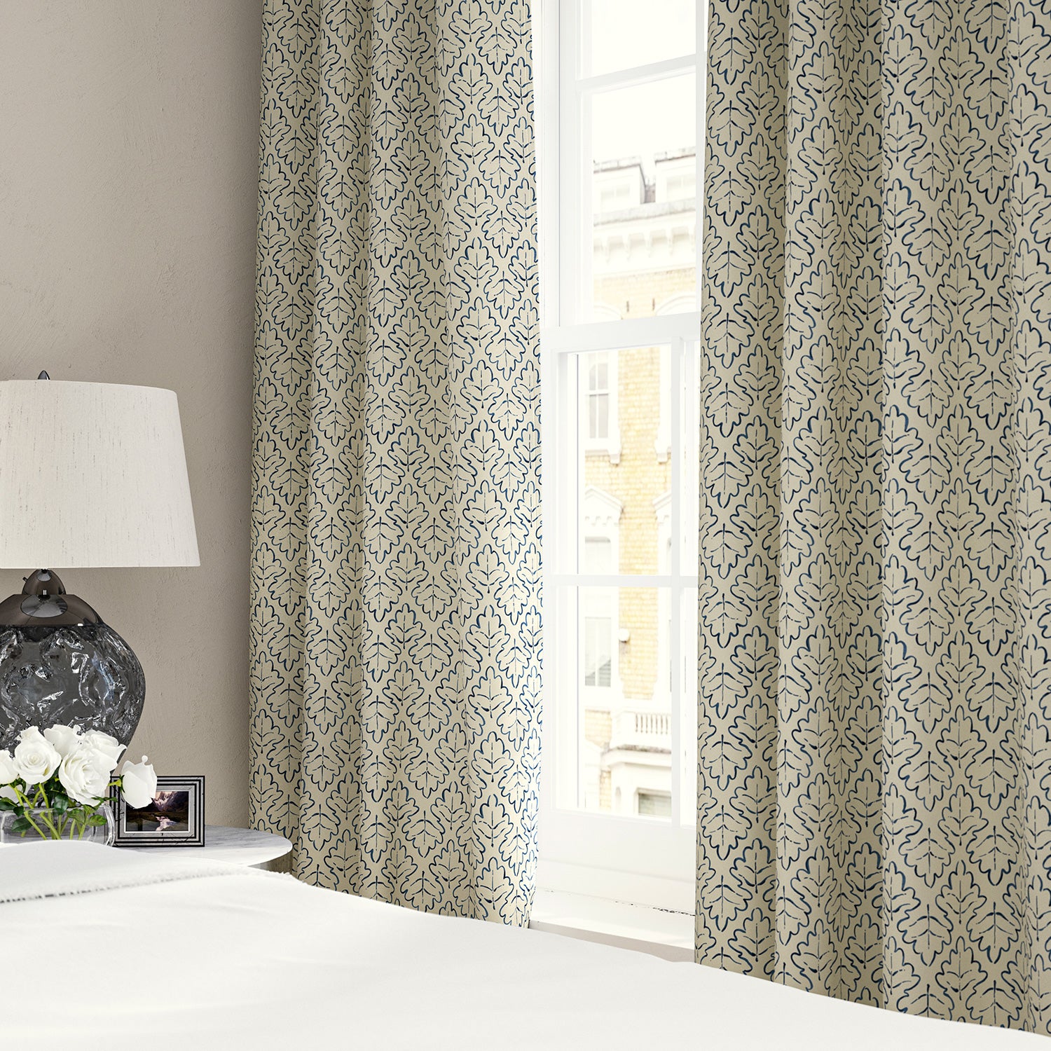 Linen curtains with a hand drawn; mirrored leaf motif pattern in blue and cream