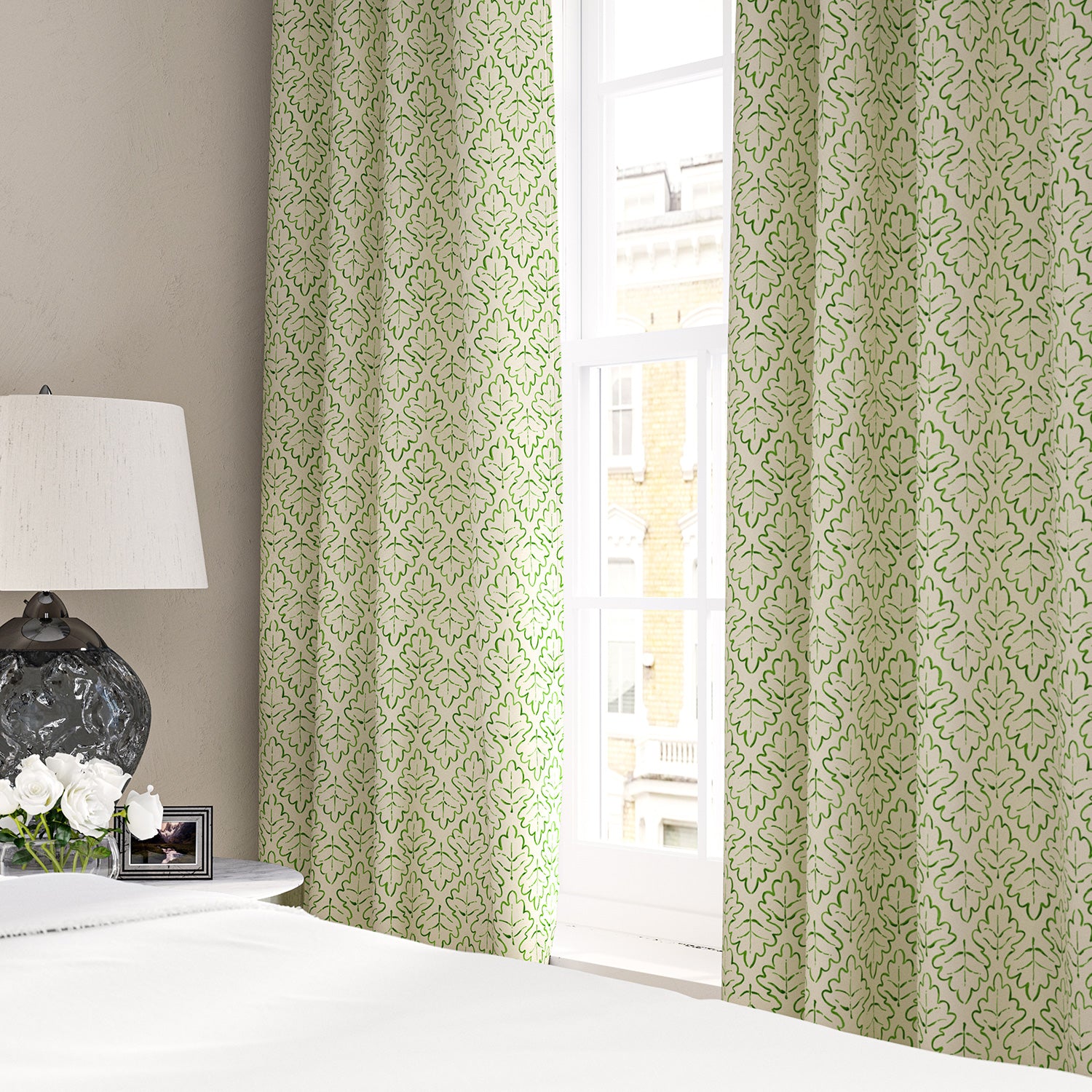 Linen curtains with a hand drawn; mirrored leaf motif pattern in green and cream
