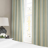 Linen curtains with a bold blocks of colour in this inviting stripe are softened with a painterly finish in blue, cream and white