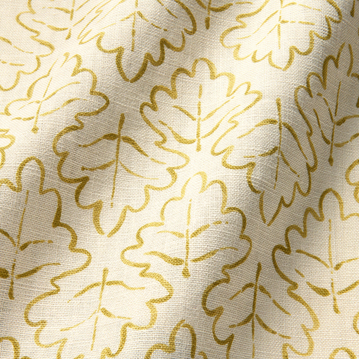 Printed linen fabric sample – a hand drawn; mirrored leaf motif pattern in yellow and cream