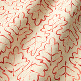 Printed linen fabric sample – a hand drawn; mirrored leaf motif pattern in red and cream