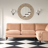 Sofa upholstered in a pink velvet upholstery fabric