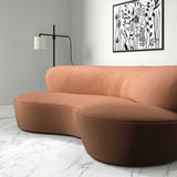 Sofa upholstered in a orange velvet upholstery fabric
