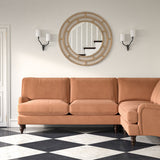 Sofa upholstered in a orange velvet upholstery fabric