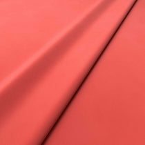 Fabric swatch of a pink velvet upholstery fabric