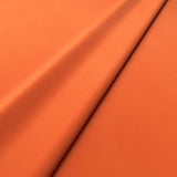 Fabric swatch of a orange velvet upholstery fabric