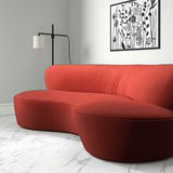Sofa upholstered in a orange velvet upholstery