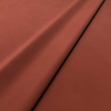 Fabric swatch of a orange velvet upholstery fabric