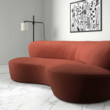 Sofa upholstered in a orange velvet upholstery fabric