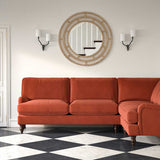 Sofa upholstered in a orange velvet upholstery fabric 