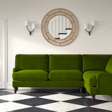 Sofa upholstered in a green velvet upholstery fabric 