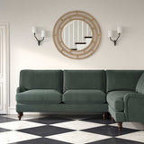 Sofa upholstered in a grey velvet upholstery fabric 