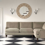 Sofa upholstered in a grey velvet upholstery fabric 