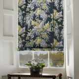 Blinds in a printed linen fabric with a wisteria floral pattern in blue and green colours.