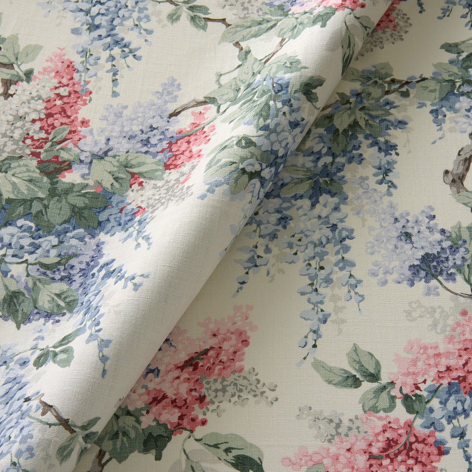 Printed linen fabric with wisteria floral pattern in light colours for linen curtains, blinds and upholstery.