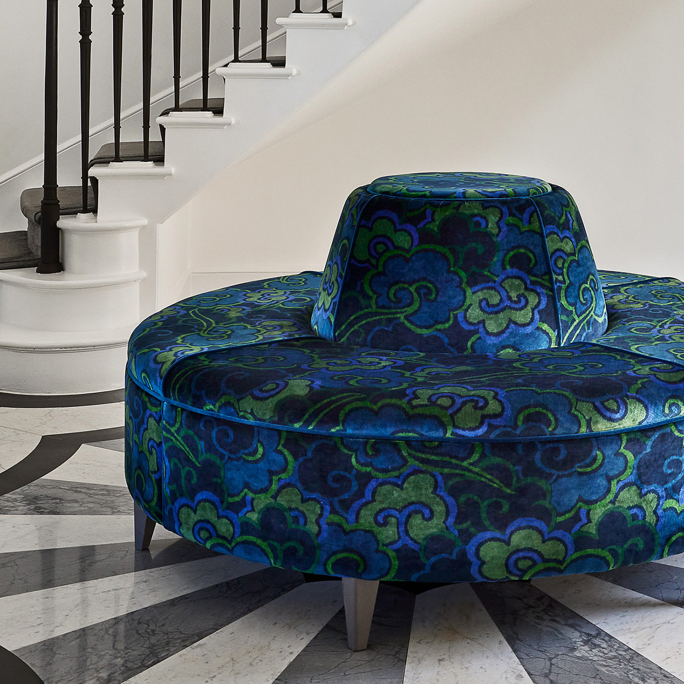 Velvet sofa upholstered in a printed velvet fabric with enchanting landscape of abstract clouds design in blue and green colours.