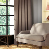 Living room featuring a sofa and curtains in a plain neutral eco-friendly fabric