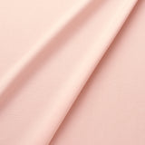 Fabric swatch of a eco-friendly plain pastel pink fabric for curtains and upholstery