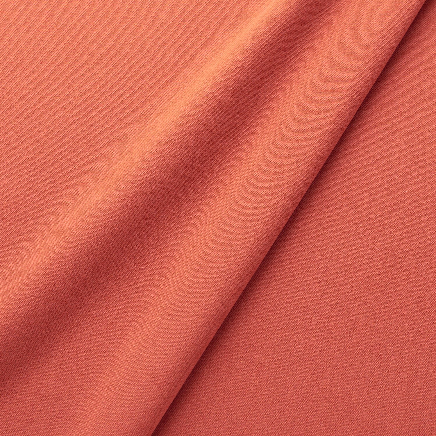 Fabric swatch of a eco-friendly plain orange fabric for curtains and upholstery