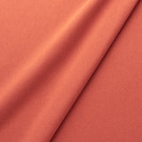 Fabric swatch of a eco-friendly plain orange fabric for curtains and upholstery
