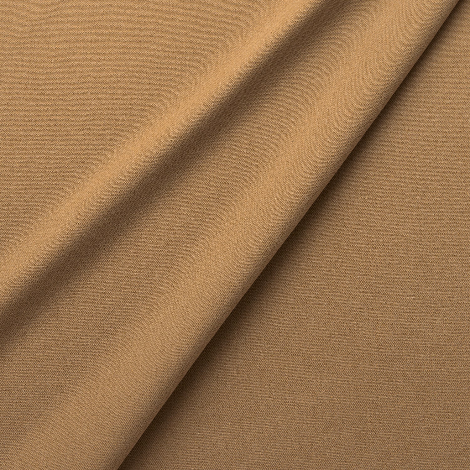 Fabric swatch of a eco-friendly plain brass coloured fabric for curtains and upholstery