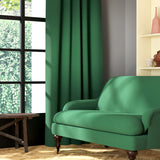 Living room featuring a sofa and curtains in a plain emerald green eco-friendly fabric