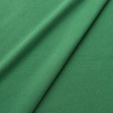 Fabric swatch of a eco-friendly plain emerald green fabric for curtains and upholstery
