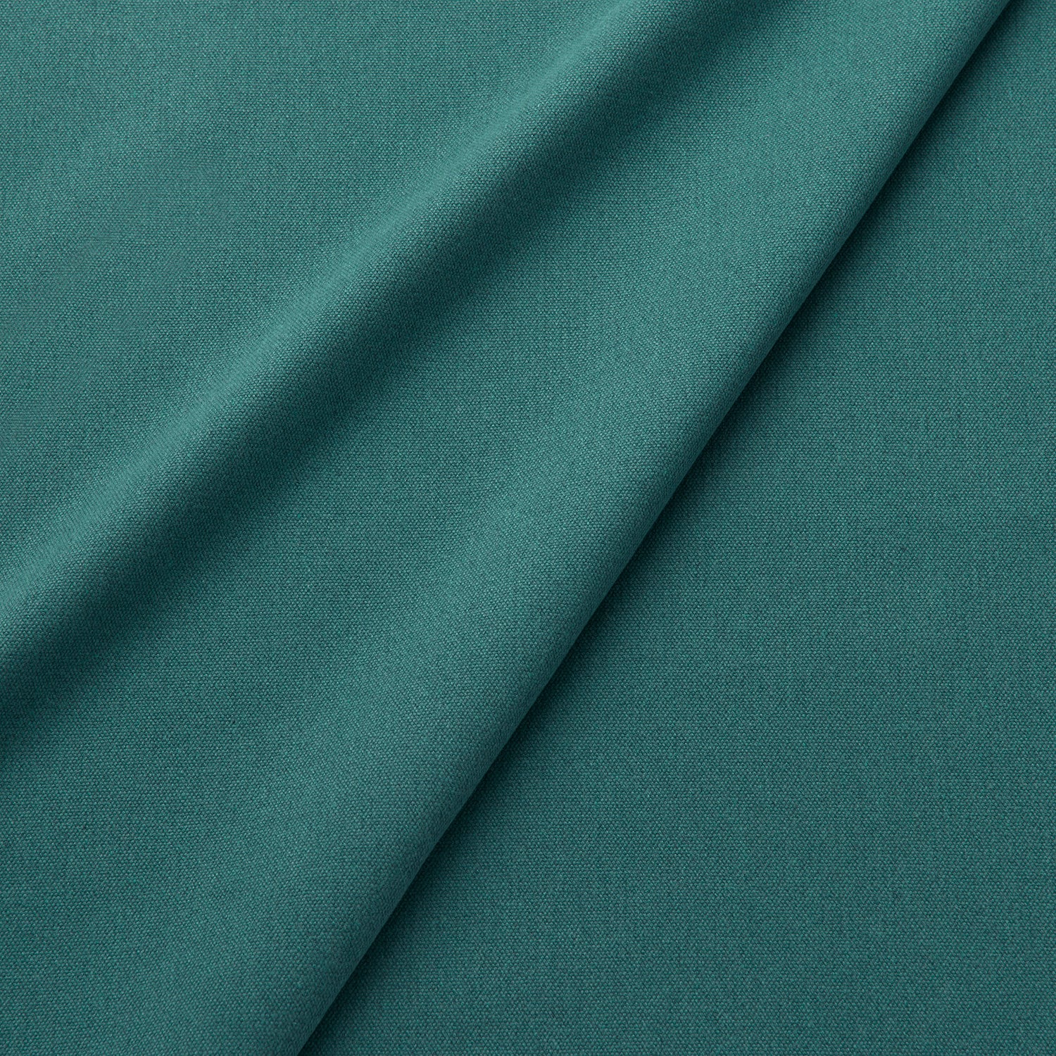Fabric swatch of a eco-friendly plain teal fabric for curtains and upholstery