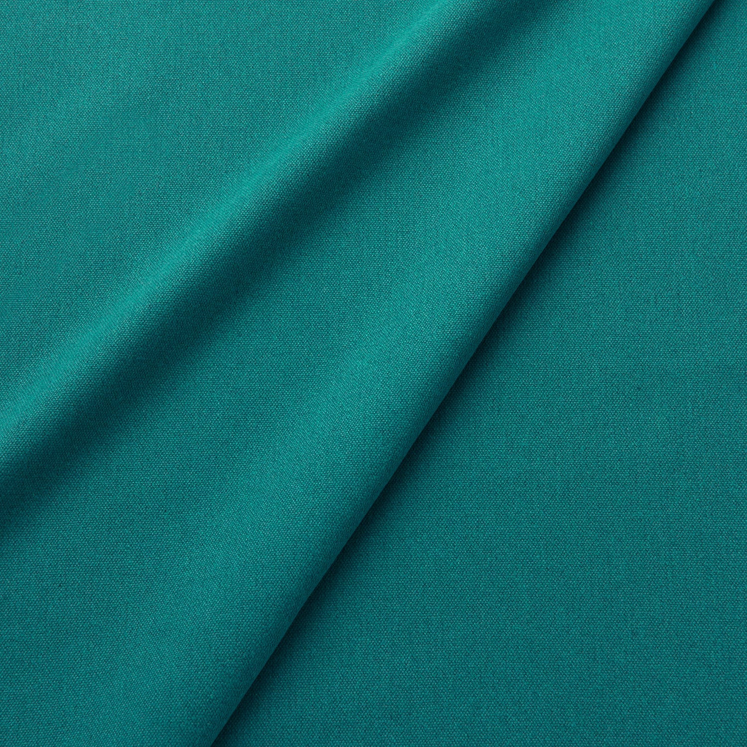Fabric swatch of a eco-friendly plain teal fabric for curtains and upholstery