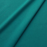 Fabric swatch of a eco-friendly plain teal fabric for curtains and upholstery
