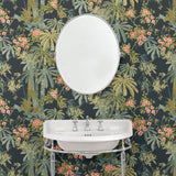 Bathroom with a tropical wallpaper in navy with exotic, floral blossoms intertwined with bamboo.