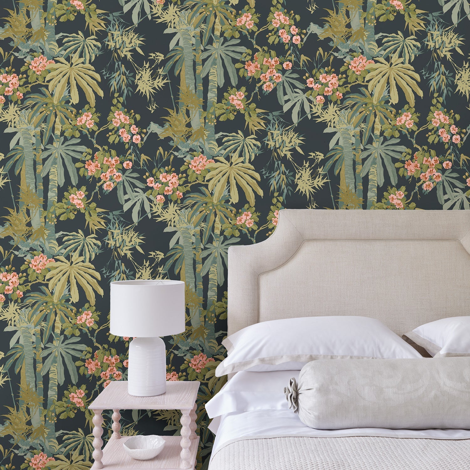 Bedroom with a tropical wallpaper in navy with exotic, floral blossoms intertwined with bamboo.