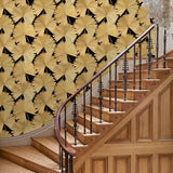 Hallway showcasing a contemporary floral wallpaper with tropical palms in gold and black.