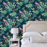 Bedroom featuring a navy floral wallpaper with exotic birds.