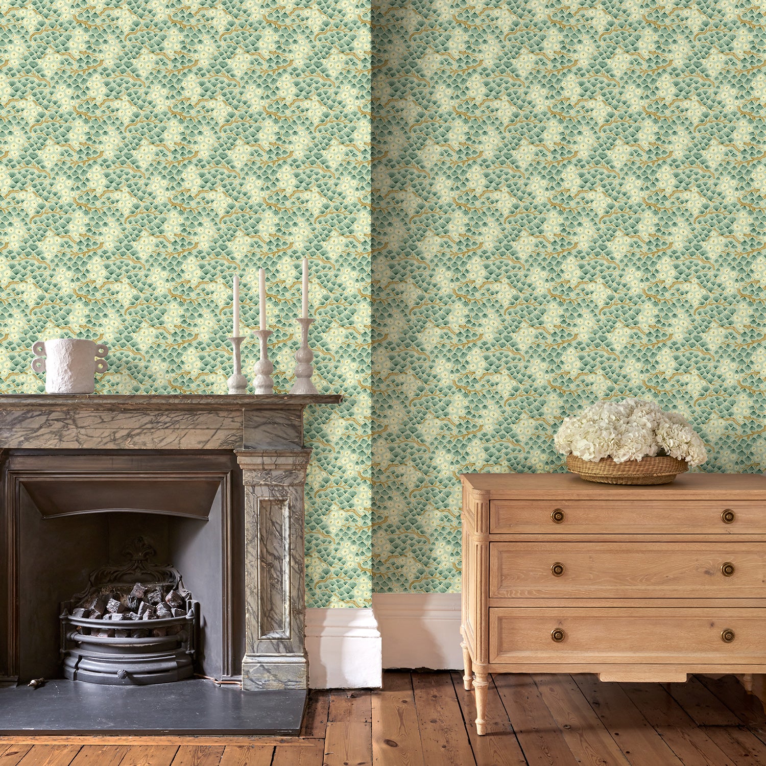 Capturing the beauty of the forest floor, this green wallpaper features leaves and flowers