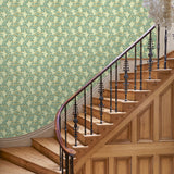 Capturing the beauty of the forest floor, this green wallpaper features leaves and flowers