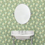 Capturing the beauty of the forest floor, this green wallpaper features leaves and flowers