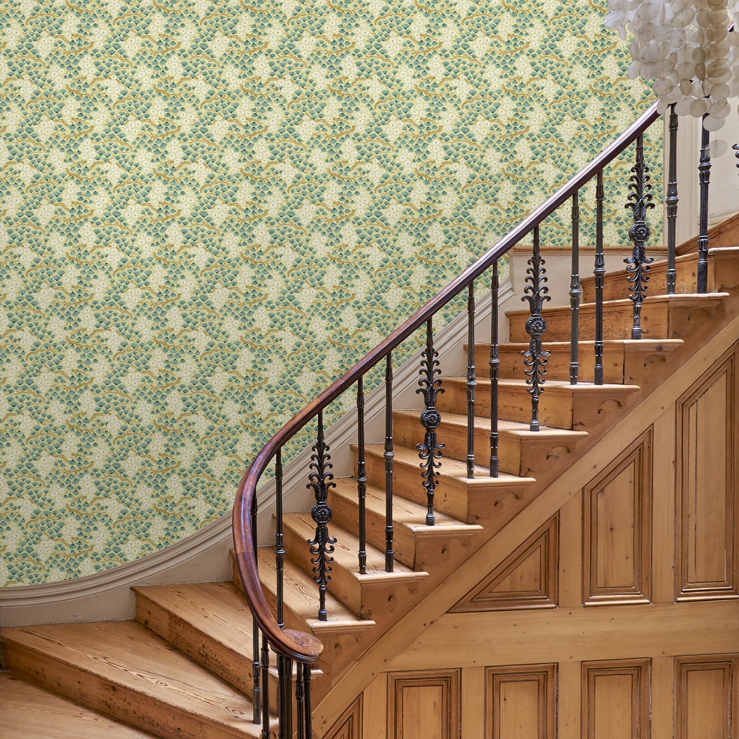 Capturing the beauty of the forest floor, this green wallpaper features leaves and flowers