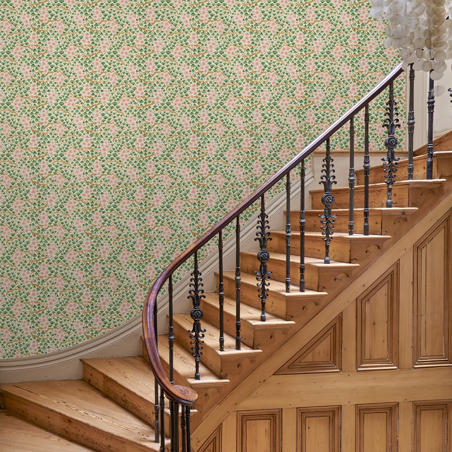 Capturing the beauty of the forest floor, this pink wallpaper features leaves and flowers