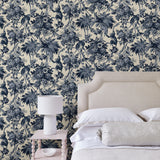 Bedroom featuring a tropical wallpaper with a classic monkey pattern.