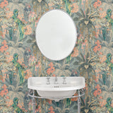 Tropical wallpaper in blue, shown in a bathroom.