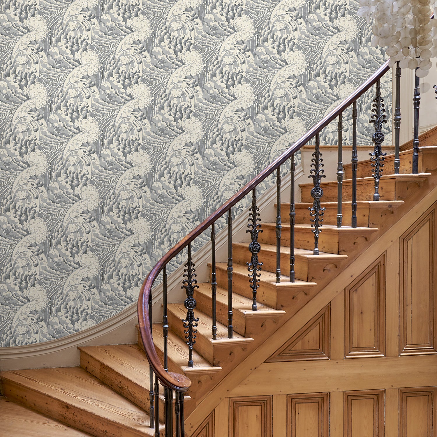 Hallway with stylish abstract wallpaper featuring dramatic, undulating waves.