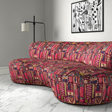 Sofa in a printed velvet fabric with city buildings in pink colours.